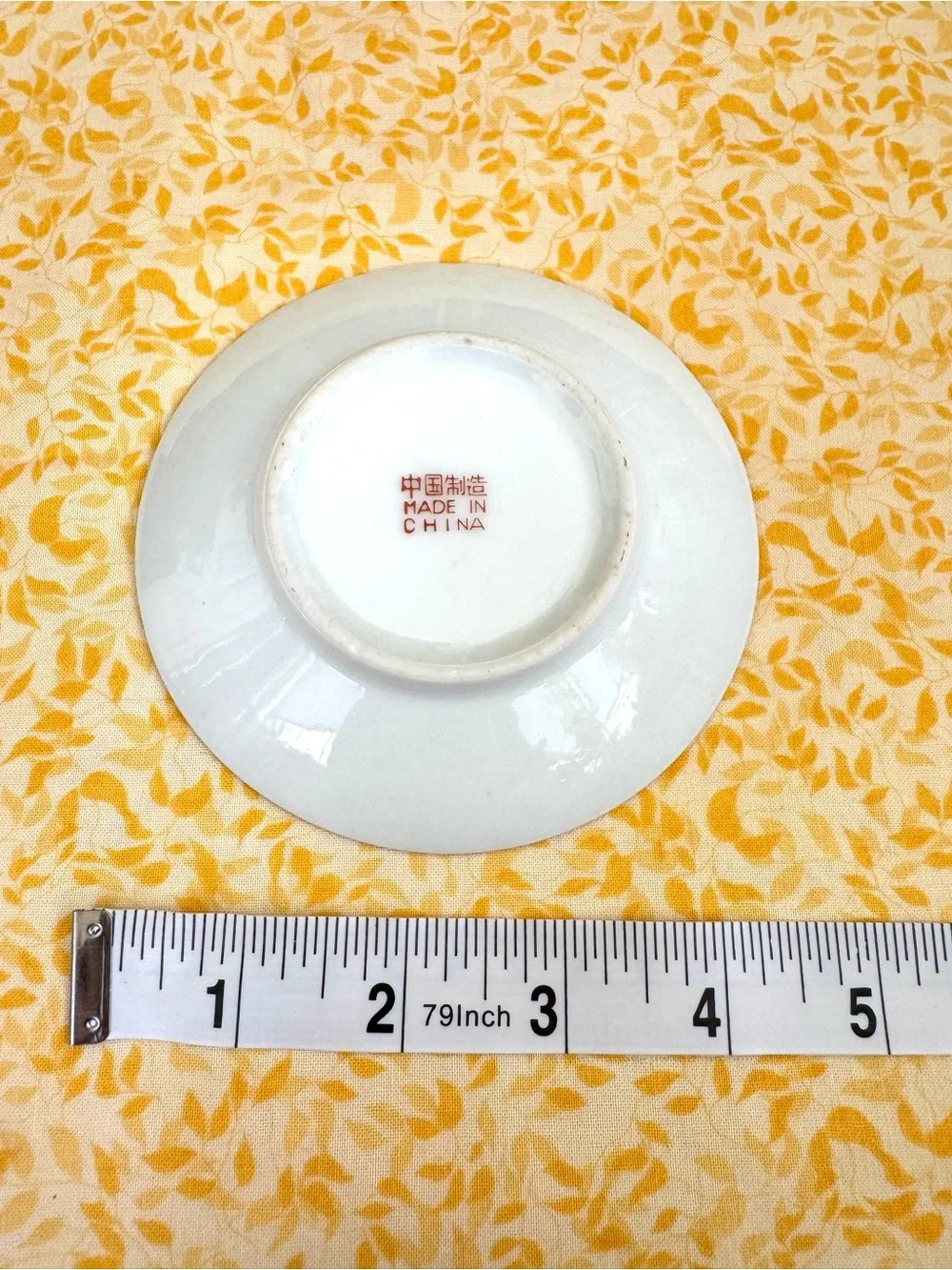 Vintage Espresso Cup and Matching Saucer. White Porcelain with Floral Motif.